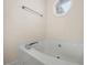 Bright, white bathtub underneath window with natural light at 124 Roscommon Ln, Clayton, NC 27520