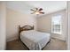 Cozy bedroom with a ceiling fan and natural light from a window at 124 Roscommon Ln, Clayton, NC 27520