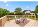 Comfortable outdoor deck furnished with chairs, rug, and side table at 124 Roscommon Ln, Clayton, NC 27520
