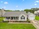 Well-maintained single-story home boasting a cozy front porch and a convenient attached garage at 124 Roscommon Ln, Clayton, NC 27520