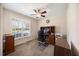 Home office with natural light, neutral walls, and a ceiling fan at 124 Roscommon Ln, Clayton, NC 27520