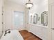 Bright bathroom featuring a standalone tub, double vanity, and natural light, creating a relaxing retreat at 131 Lavinia Ln, Chapel Hill, NC 27516