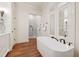 Bright bathroom featuring a standalone tub, a shower, and natural light, creating a relaxing retreat at 131 Lavinia Ln, Chapel Hill, NC 27516