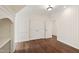 Bonus room has hardwood floors and bright lighting with double doors at 131 Lavinia Ln, Chapel Hill, NC 27516
