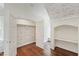 Bedroom closet with patterned wallpaper and hardwood floors at 131 Lavinia Ln, Chapel Hill, NC 27516