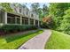 Inviting traditional home with a charming brick walkway and a beautifully landscaped front yard at 131 Lavinia Ln, Chapel Hill, NC 27516