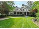 Charming traditional home with lush landscaping, a brick walkway, and a classic, inviting facade at 131 Lavinia Ln, Chapel Hill, NC 27516