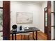 Well-lit office space with sleek desk, hardwood floors, and stylish decor for a productive work environment at 131 Lavinia Ln, Chapel Hill, NC 27516