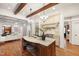 Open-concept kitchen with island seating, chandelier lighting, and seamless access to living areas at 131 Lavinia Ln, Chapel Hill, NC 27516