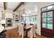 Bright kitchen and dining nook with built-in seating, stainless appliances, and modern lighting at 131 Lavinia Ln, Chapel Hill, NC 27516