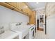 Well-organized laundry room with sink, washer, dryer and ample cabinet storage at 131 Lavinia Ln, Chapel Hill, NC 27516