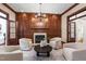 Elegant living room boasts a fireplace, refined millwork, hardwood floors and natural light at 131 Lavinia Ln, Chapel Hill, NC 27516