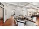 Cozy living room with hardwood floors, neutral furniture, and open access to other rooms at 131 Lavinia Ln, Chapel Hill, NC 27516