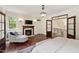 Beautiful main bedroom with fireplace, hardwood floors, sitting area, and an adjoining staircase at 131 Lavinia Ln, Chapel Hill, NC 27516