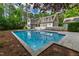 Backyard pool reflecting surrounding house, landscape and the sky at 131 Lavinia Ln, Chapel Hill, NC 27516