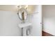 Powder room features beadboard walls and a pedestal sink at 131 Lavinia Ln, Chapel Hill, NC 27516