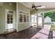 A view of the screened in porch featuring brick flooring and a glimpse of the backyard at 131 Lavinia Ln, Chapel Hill, NC 27516