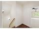 Staircase with hardwood steps and white risers lead to the living areas at 131 Lavinia Ln, Chapel Hill, NC 27516