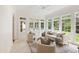 Inviting sunroom with a neutral color scheme, patio views and great natural lighting at 131 Lavinia Ln, Chapel Hill, NC 27516