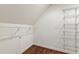 Spacious walk-in closet with custom shelving units and hardwood floors at 131 Lavinia Ln, Chapel Hill, NC 27516