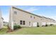 Spacious backyard with lush green grass, patio area, and well-maintained landscaping at 133 Explorer Dr # 258, Morrisville, NC 27560
