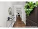 Inviting entryway with hardwood floors and stylish console table and a view to the living area at 133 Explorer Dr # 258, Morrisville, NC 27560
