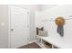Cozy entryway with bench seating, hooks for storage, and a welcoming atmosphere at 133 Explorer Dr # 258, Morrisville, NC 27560