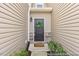 Charming entryway with a decorative wreath and manicured landscaping at 133 Explorer Dr # 258, Morrisville, NC 27560