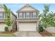Charming two-story home featuring a two-car garage, neutral siding, and manicured front yard at 133 Explorer Dr # 258, Morrisville, NC 27560