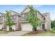 View of a home with a two-car garage and neutral-toned siding at 133 Explorer Dr # 258, Morrisville, NC 27560