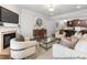 Open-concept living space with a fireplace, modern furniture, and a seamless flow to the kitchen at 133 Explorer Dr # 258, Morrisville, NC 27560