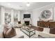 Bright and airy living room boasts a fireplace, large windows, and a contemporary design at 133 Explorer Dr # 258, Morrisville, NC 27560