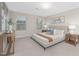 Bright main bedroom with large windows, neutral tones, and comfortable bedding at 133 Explorer Dr # 258, Morrisville, NC 27560