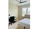Bedroom features a bed, desk, chair, neutral paint, and ample natural light at 142 Philips Sq, Chapel Hill, NC 27516