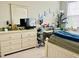 Bedroom featuring a dresser, desk, and decoratively adorned walls at 142 Philips Sq, Chapel Hill, NC 27516