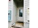 Exterior entrance features a frosted glass door, painted brick, and a small porch at 142 Philips Sq, Chapel Hill, NC 27516
