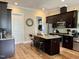 Eat-in kitchen boasts a center island, stainless appliances, and convenient access to the pantry at 142 Philips Sq, Chapel Hill, NC 27516