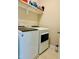 Laundry room features a Whirlpool washer and dryer set, and a wire shelf at 142 Philips Sq, Chapel Hill, NC 27516