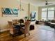 Comfortable living room with dining area, featuring hardwood floors and modern lighting at 142 Philips Sq, Chapel Hill, NC 27516