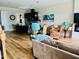 Open-concept living room with hardwood floors, modern decor, and a view of the kitchen at 142 Philips Sq, Chapel Hill, NC 27516
