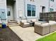 Cozy outdoor patio features comfortable seating, perfect for relaxing or entertaining guests at 142 Philips Sq, Chapel Hill, NC 27516
