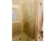 Modern shower features glass door, beige tiling, and sleek hardware at 142 Philips Sq, Chapel Hill, NC 27516