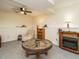 Spacious finished basement featuring a fireplace and a unique wagon wheel table at 1509 Elkpark Dr, Raleigh, NC 27610