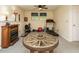 Finished basement with fireplace, work out equipment and wagon wheel table at 1509 Elkpark Dr, Raleigh, NC 27610