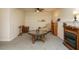 Finished basement with a unique wagon wheel table, fireplace and neutral carpeting at 1509 Elkpark Dr, Raleigh, NC 27610