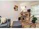 Bright bedroom featuring natural light, a rustic wood desk, and comfortable seating area at 1509 Elkpark Dr, Raleigh, NC 27610