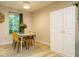 Charming dining room with seating for four and natural light from the nearby window at 1509 Elkpark Dr, Raleigh, NC 27610