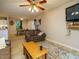Inviting living space with hardwood flooring, comfortable seating, open to a kitchen and dining area and a TV at 1509 Elkpark Dr, Raleigh, NC 27610