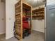 Storage room equipped with wooden shelves, closet and mini-refrigerator at 1509 Elkpark Dr, Raleigh, NC 27610