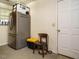 Functional utility area featuring a refrigerator, exterior door, and ample space at 1509 Elkpark Dr, Raleigh, NC 27610
